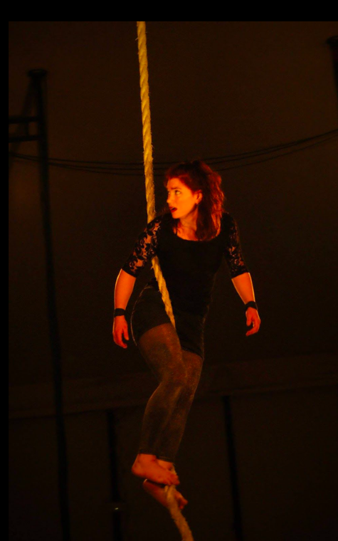 Aerial rope performance — warm stage light